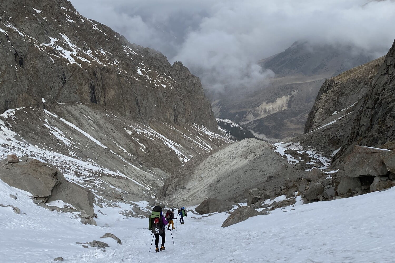 Descending over snow from Ratsek Hut