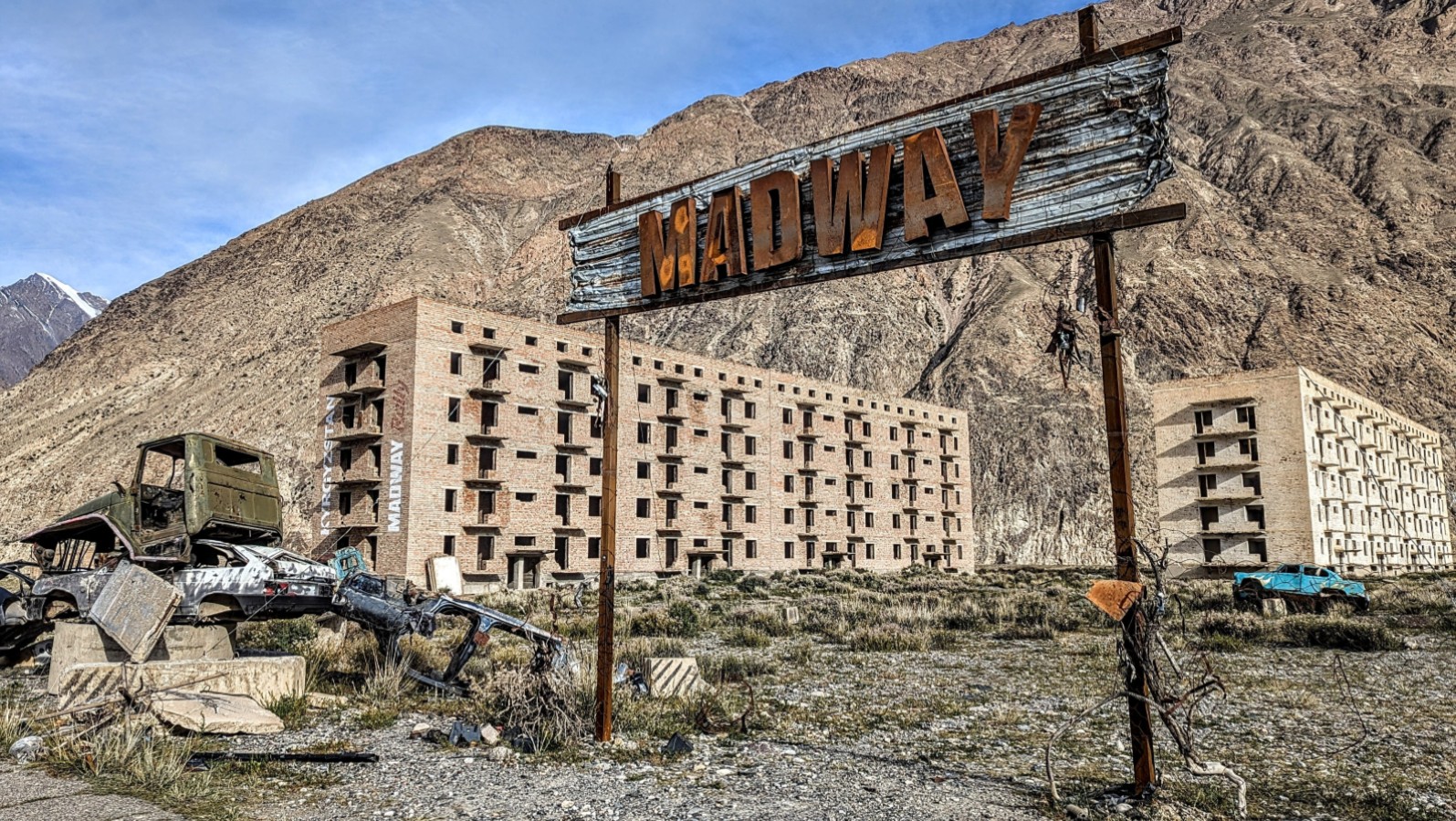 Abandoned cars found near desolate Soviet buildings near Enilchek Town.