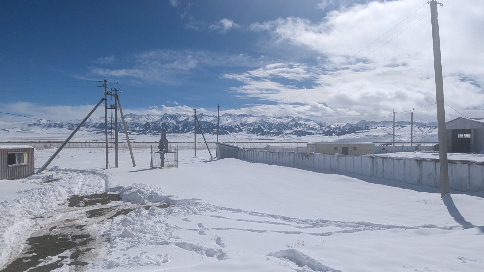 The snowy Kegen plateau with the mountainous backdrop of the Tien-Shan.