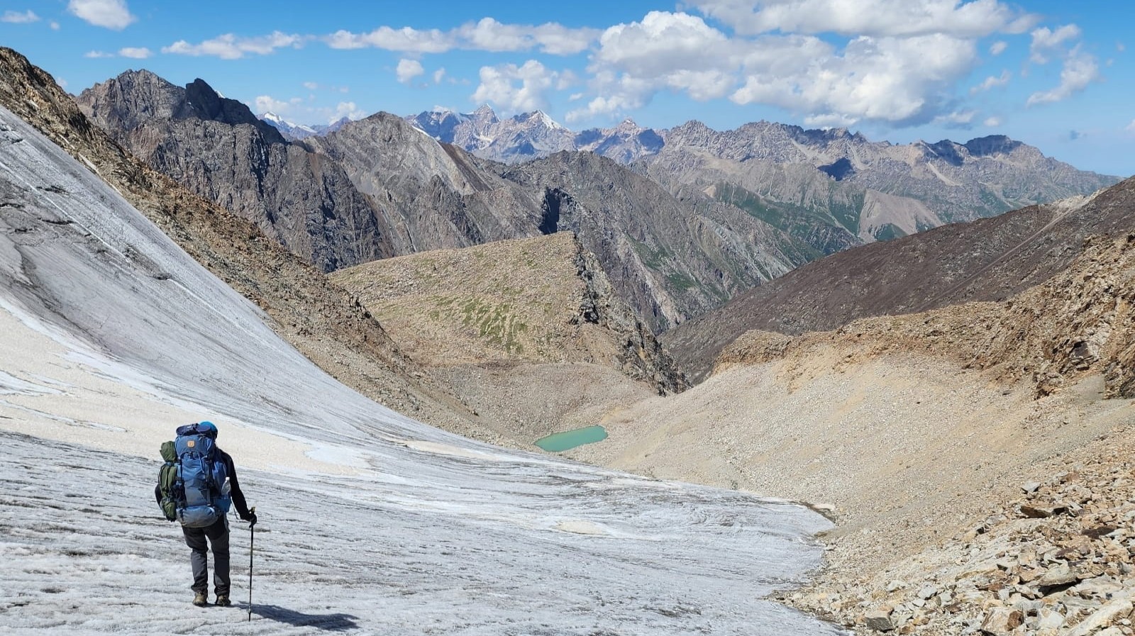 Trekker descending a glacier in Terskey Ala-Too Range