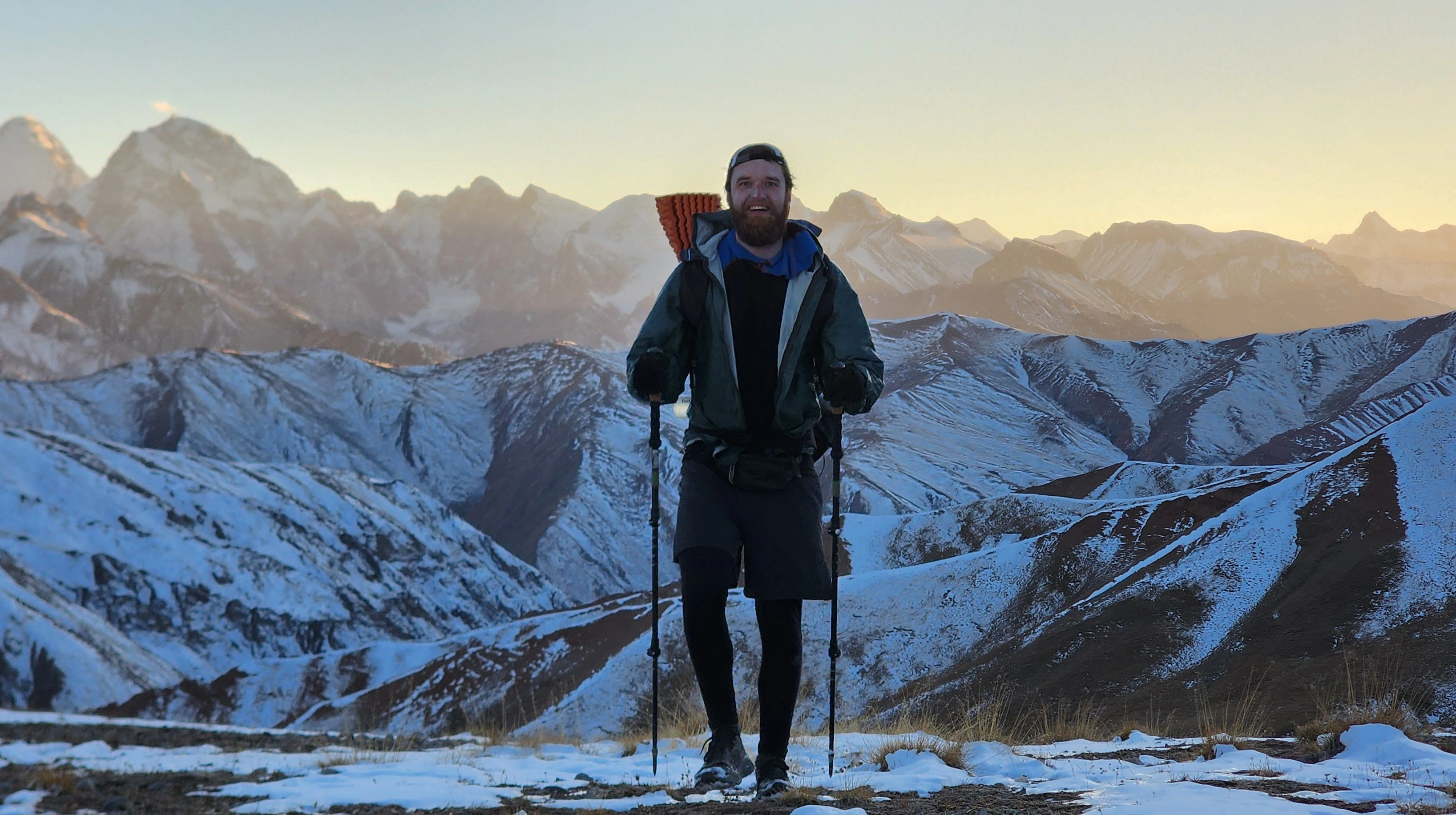 Hiker approaching a mountain pass in Central Kyrgyzstan