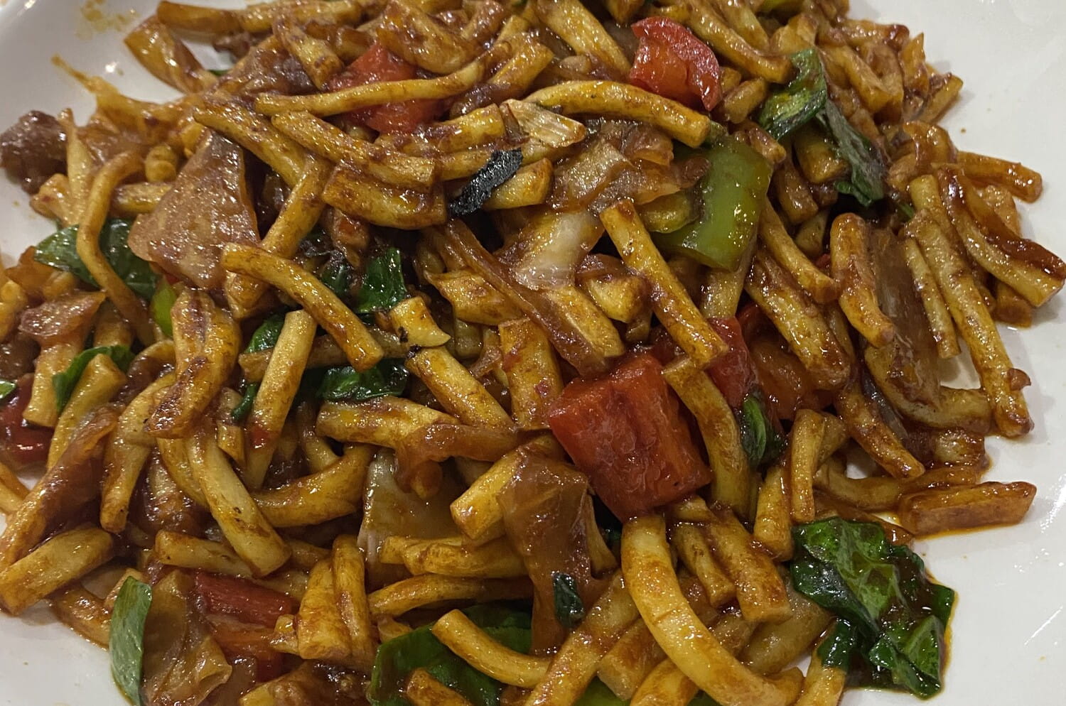 A plate of Fried Lagman in a traditional Kyrgyz Chaikhana