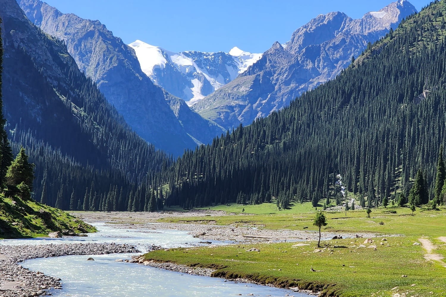 Pristine August blue skies in Kyrgyzstan's iconic Terskey Ala-Too Mountain Range